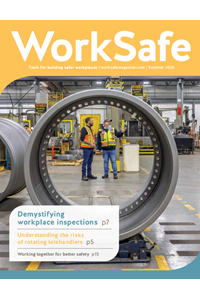 Cover of WorkSafe magazine Summer 2026 featuring a large circular industrial metal component in the foreground framing two workers in high‑visibility safety vests standing and talking inside a manufacturing facility. The cover includes text: ‘WorkSafe,’ ‘Tools for building safer workplaces,’ and article highlights on workplace inspections, rotating telehandlers, and improving workplace safety.
